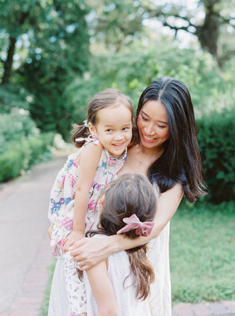 Mother and daughters smiling in a garden inspiration at Mellon Park | Pittsburgh Family photographer | Anna Laero